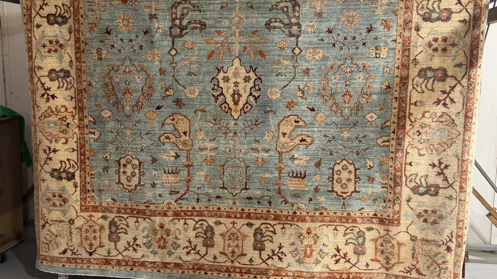 Rug drying on the rack in moving air after a full immersion wash